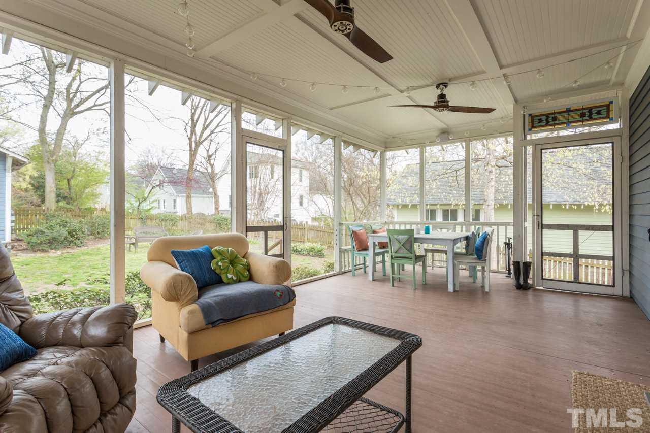 613 Elm Street Raleigh, NC 27604 - Photo 14 of 19 a living room with furniture and floor to ceiling windows