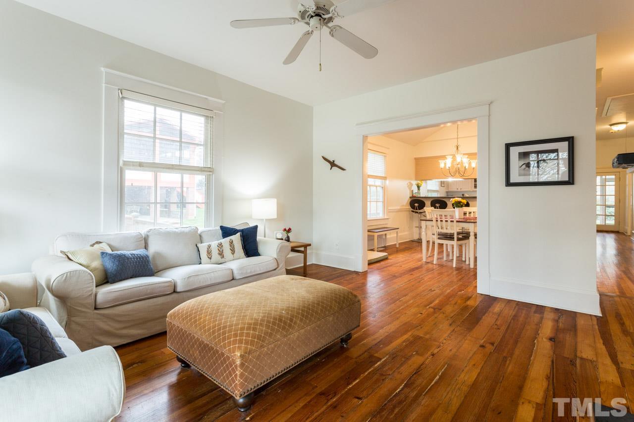613 Elm Street Raleigh, NC 27604 - Photo 3 of 19 a living room with furniture and a wooden floor
