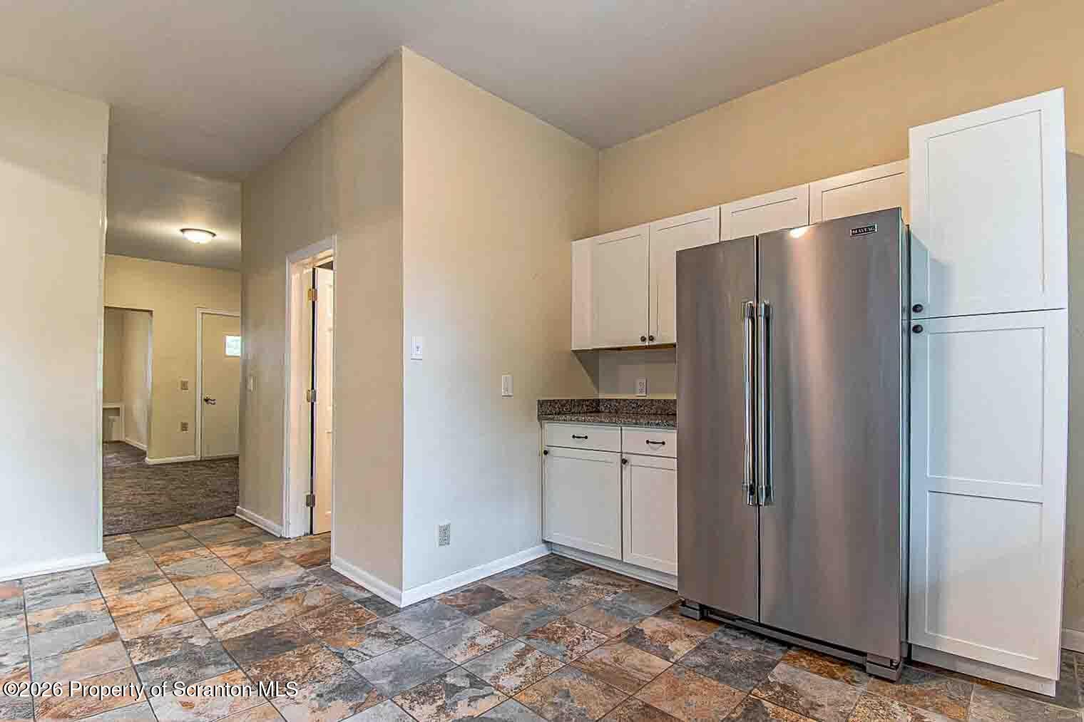 815 Monroe Avenue Scranton, PA 18510 - Photo 11 of 22 a kitchen with stainless steel appliances a refrigerator and a sink