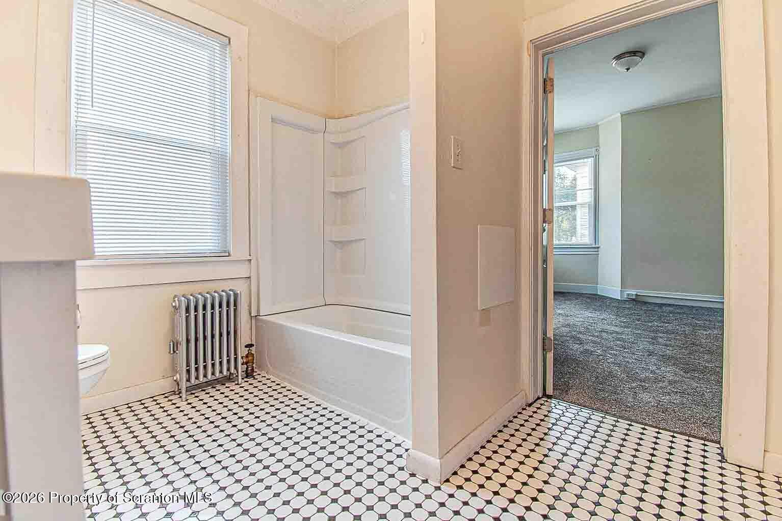 815 Monroe Avenue Scranton, PA 18510 - Photo 13 of 22 a bathroom with a bathtub and a shower