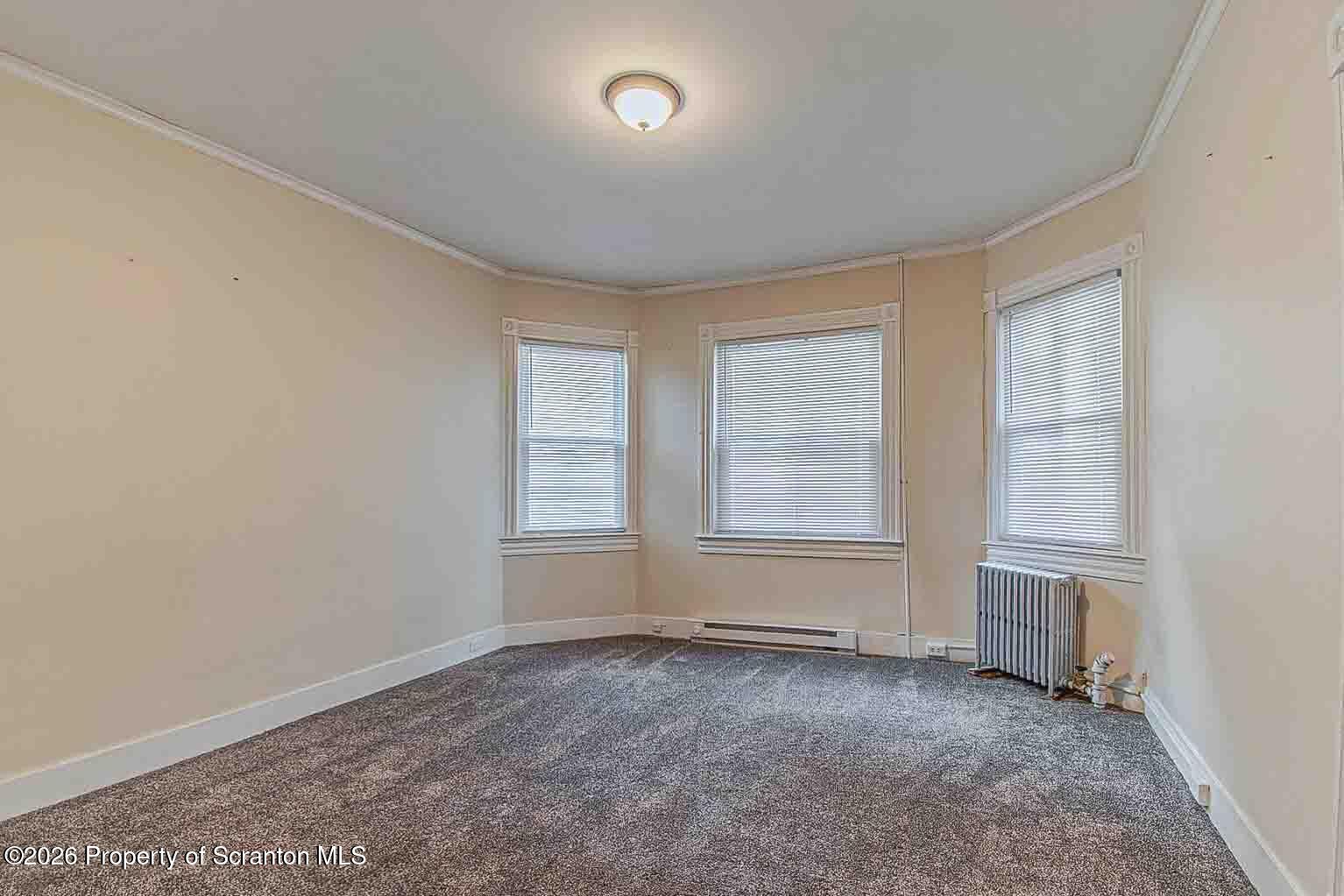 815 Monroe Avenue Scranton, PA 18510 - Photo 17 of 22 an empty room with windows