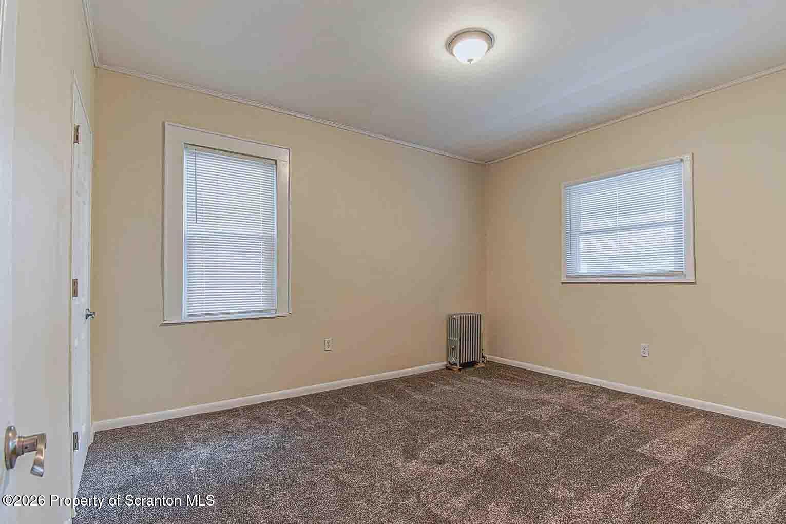815 Monroe Avenue Scranton, PA 18510 - Photo 18 of 22 a big room with windows and closet