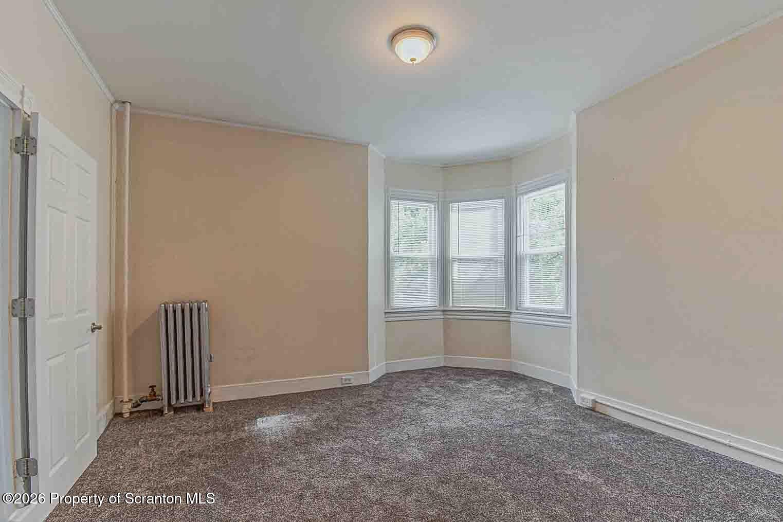 815 Monroe Avenue Scranton, PA 18510 - Photo 19 of 22 an empty room with windows