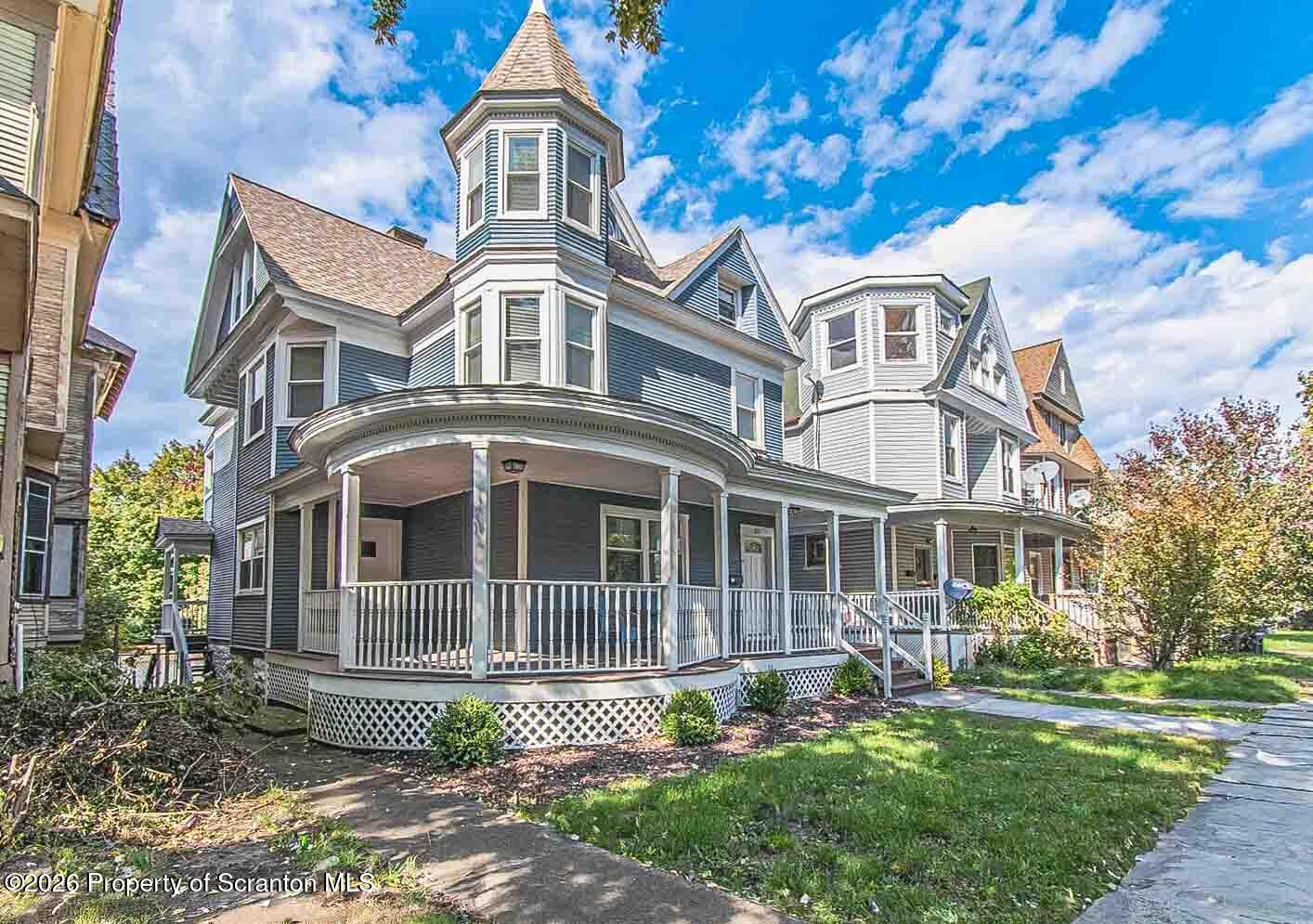 815 Monroe Avenue Scranton, PA 18510 - Photo 3 of 22 a front view of a house with a yard