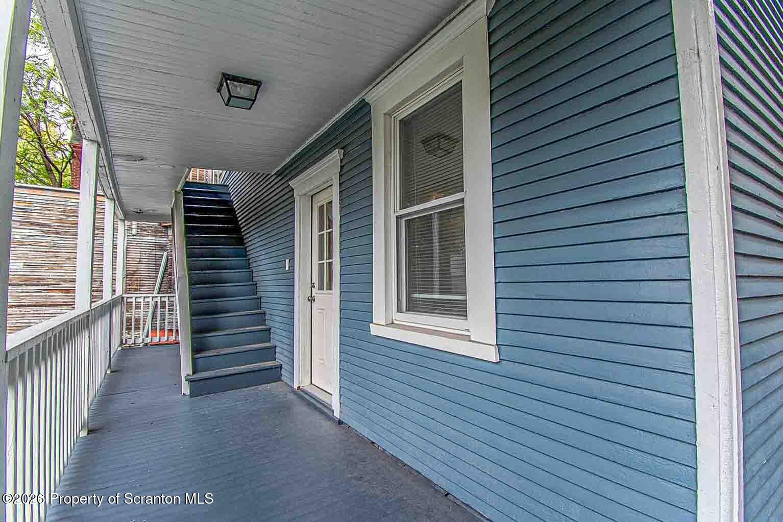 815 Monroe Avenue Scranton, PA 18510 - Photo 4 of 22 a view of a house with wooden stairs