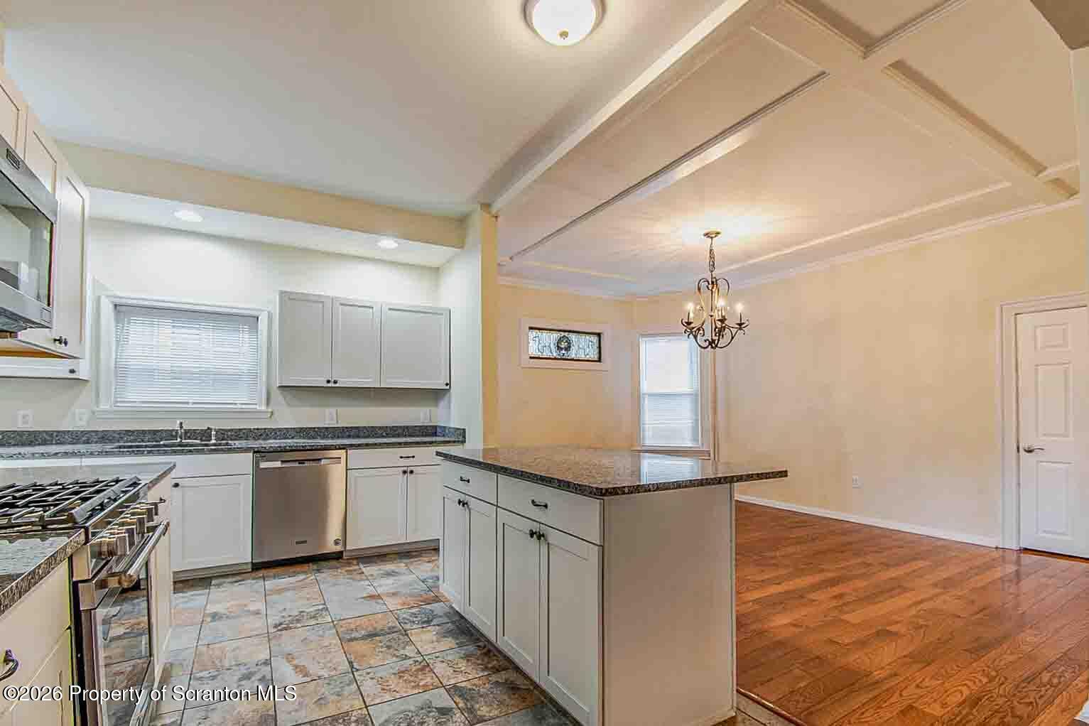 815 Monroe Avenue Scranton, PA 18510 - Photo 10 of 22 a kitchen with granite countertop a sink and cabinets