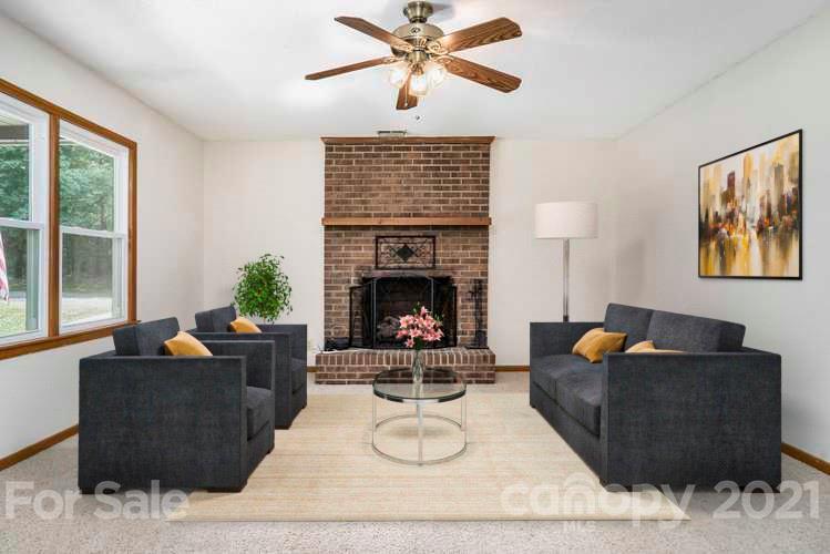 2269 Patterson Road Clover, SC 29710 - Photo 2 of 20 a living room with furniture and a fireplace