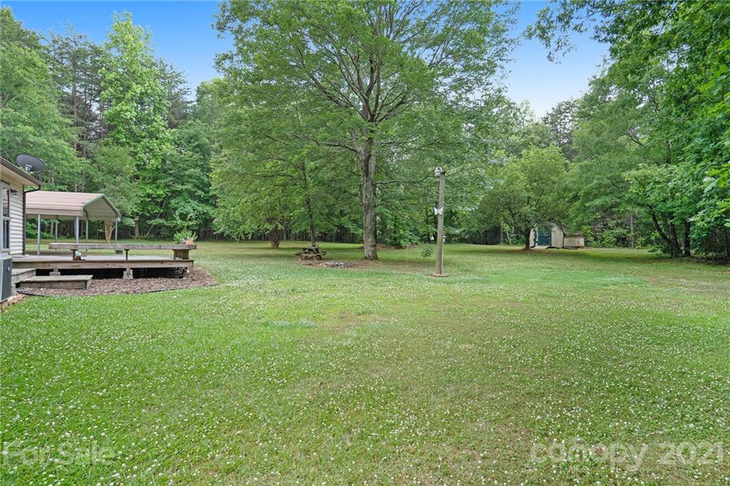 2269 Patterson Road Clover, SC 29710 - Photo 20 of 20 a backyard of a house with lots of green space and fountain