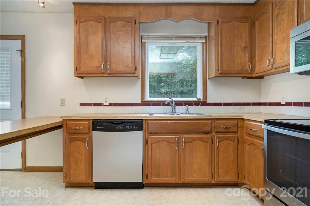 2269 Patterson Road Clover, SC 29710 - Photo 4 of 20 a kitchen with stainless steel appliances granite countertop a sink and a stove