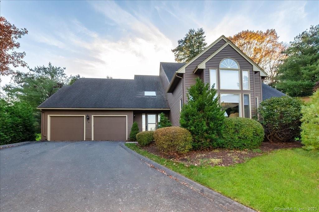 5 Saddle Ridge, Unit 5 Bloomfield, CT 06002 - Photo 1 of 1 a front view of a house with a yard and garage