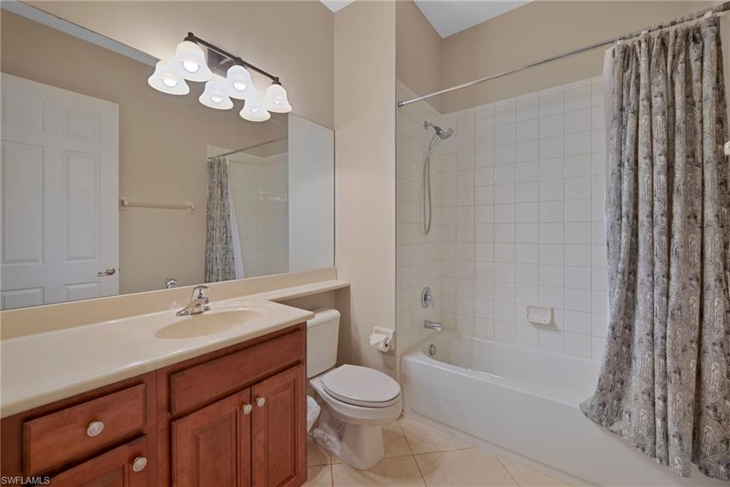 6522 Monterey Point, Unit 101 Naples, FL 34105 - Photo 13 of 29 a bathroom with a sink a toilet and shower