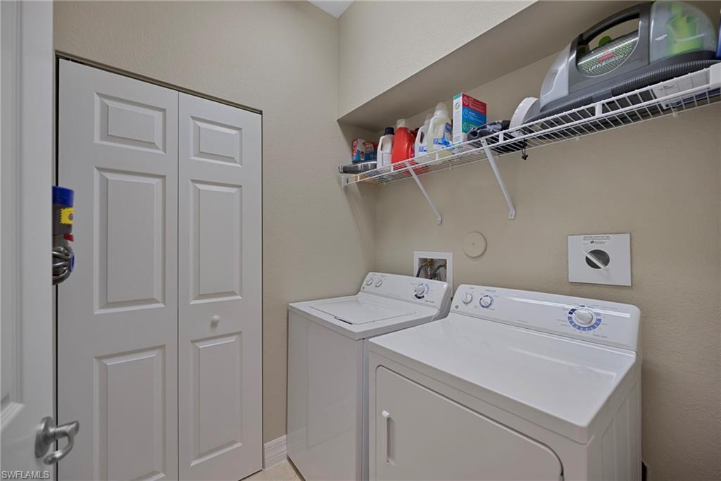 6522 Monterey Point, Unit 101 Naples, FL 34105 - Photo 14 of 29 a utility room with dryer and washer