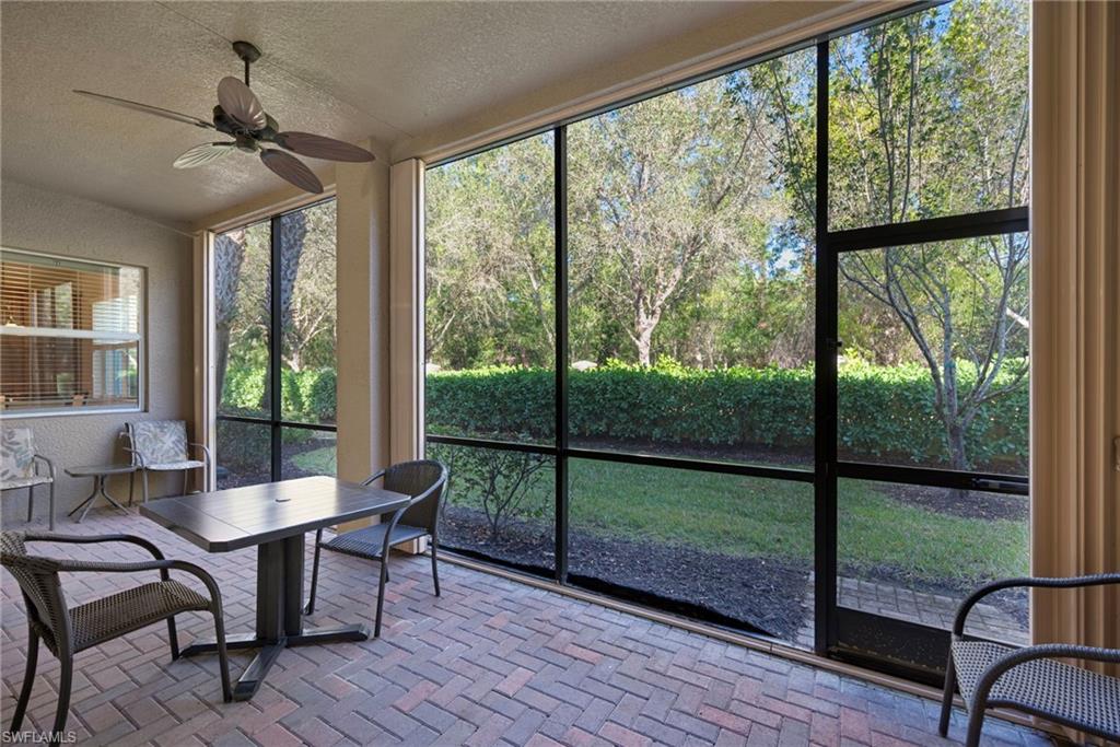 6522 Monterey Point, Unit 101 Naples, FL 34105 - Photo 15 of 29 a dining room with furniture window and wooden floor