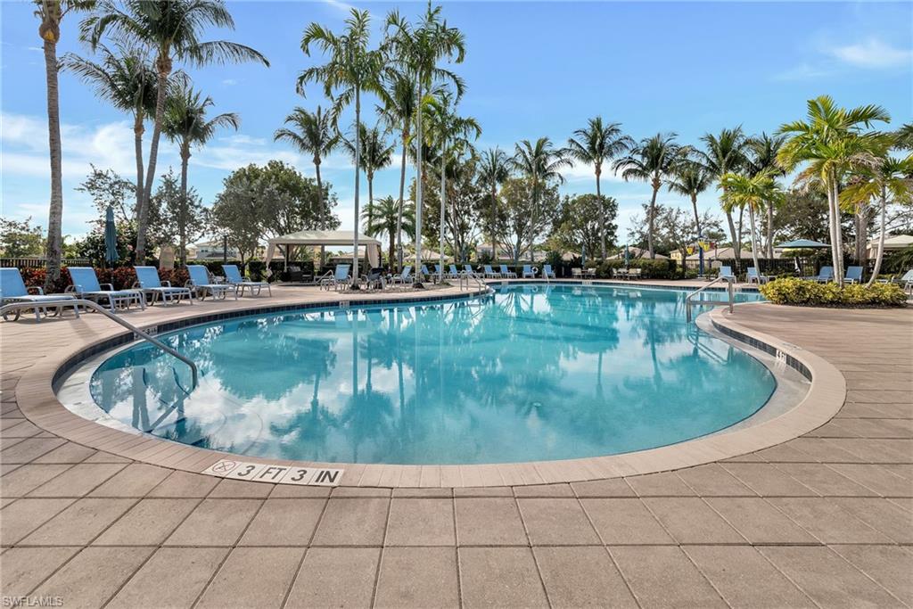 6522 Monterey Point, Unit 101 Naples, FL 34105 - Photo 17 of 29 a view of a swimming pool with outdoor seating
