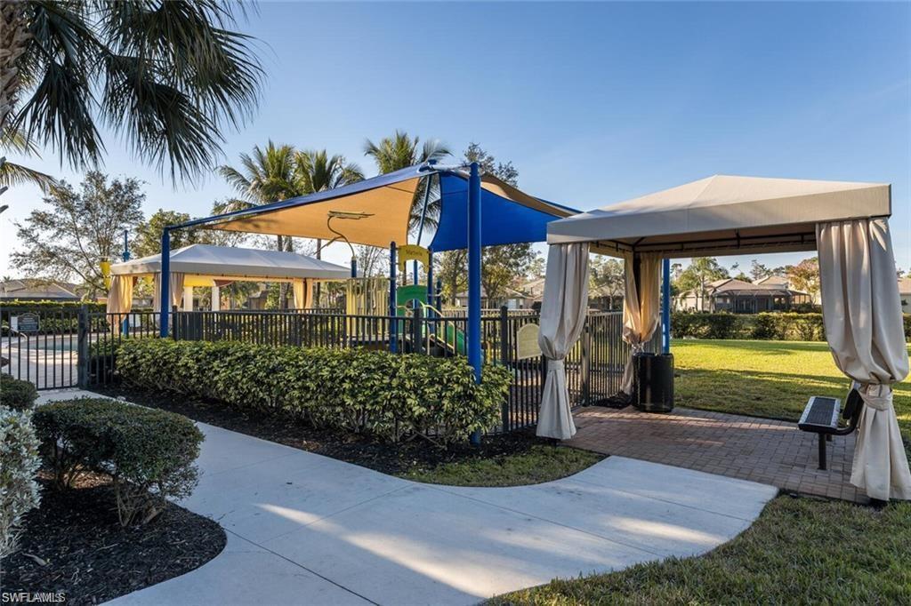 6522 Monterey Point, Unit 101 Naples, FL 34105 - Photo 19 of 29 a view of a house with backyard and sitting area