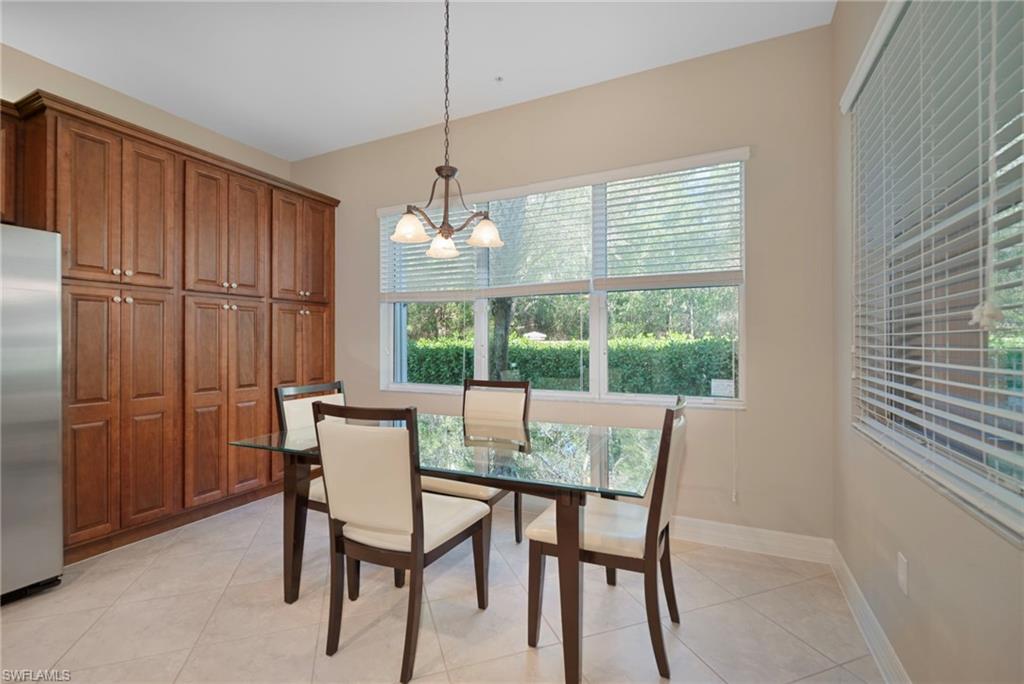 6522 Monterey Point, Unit 101 Naples, FL 34105 - Photo 7 of 29 a view of a dining room with furniture window and outside view