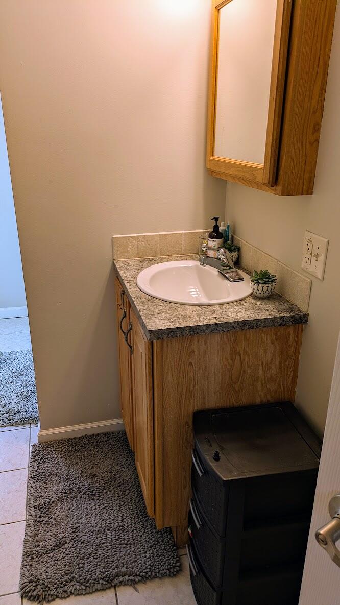82 Old Orchard Road Eastham, MA 02642 - Photo 13 of 20 a bathroom with a sink a toilet and a mirror