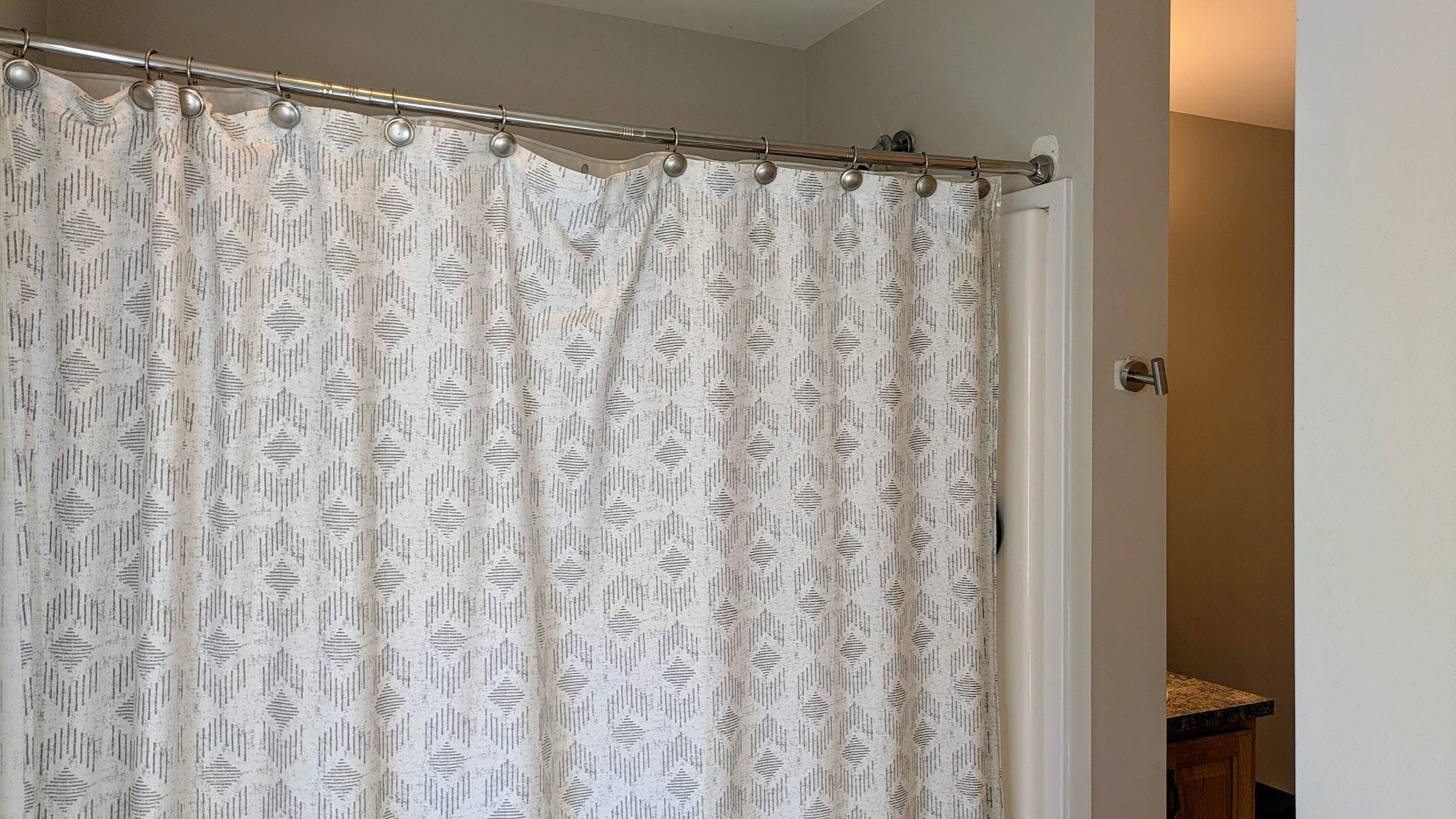 82 Old Orchard Road Eastham, MA 02642 - Photo 14 of 20 a bathroom with a shower curtain and a curtain