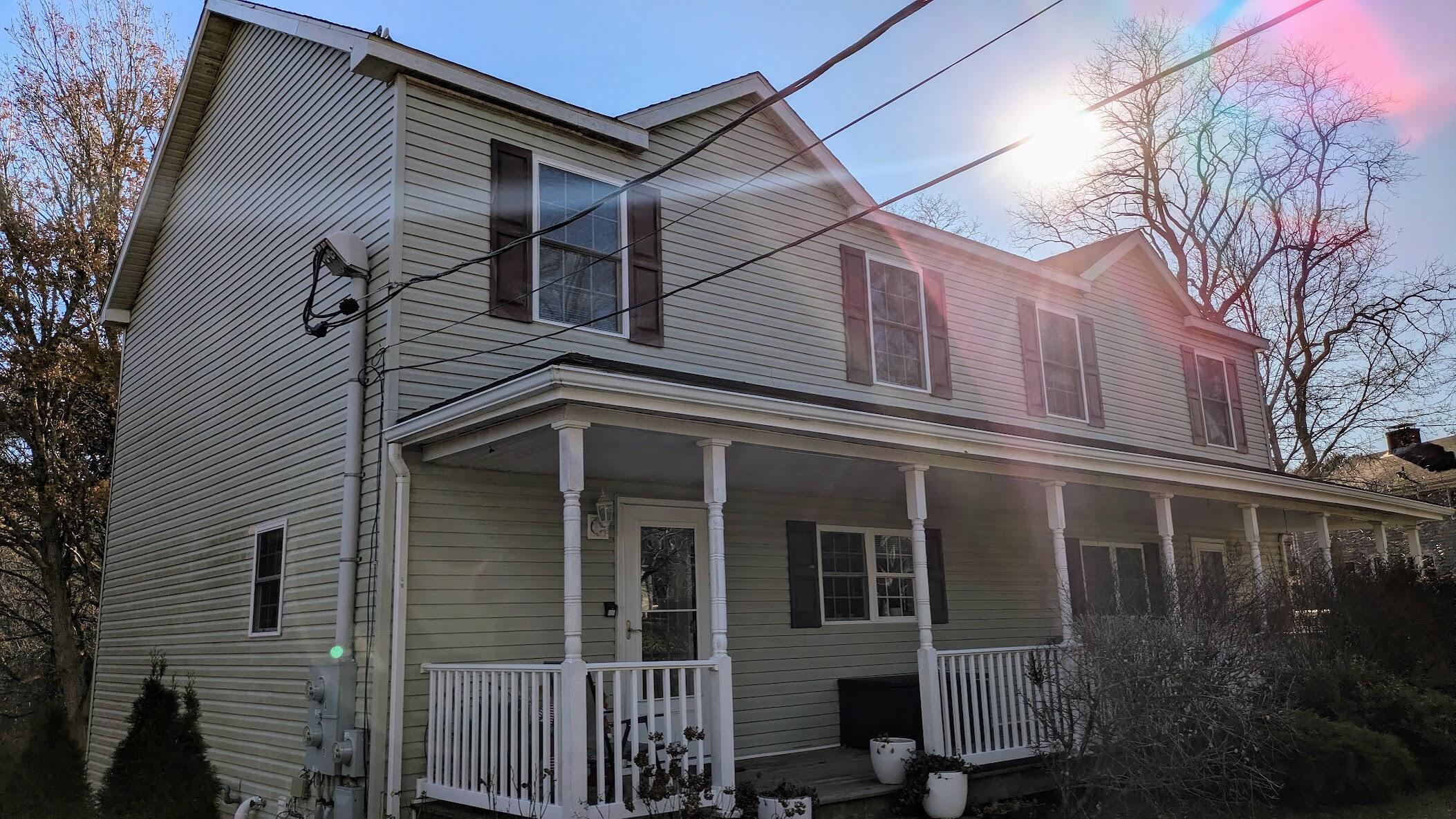 82 Old Orchard Road Eastham, MA 02642 - Photo 20 of 20 a view of a house with a yard and potted plants