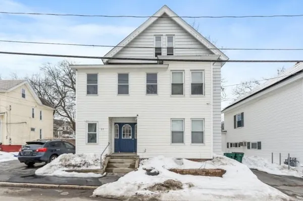 a front view of a house with a yard