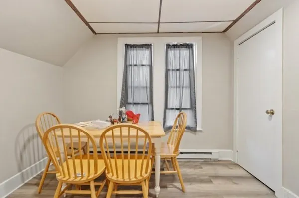 a view of a dining room with furniture and window