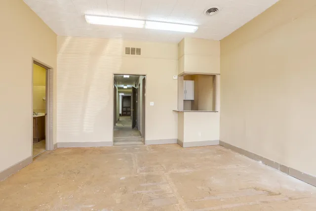 a view of an empty room with a window