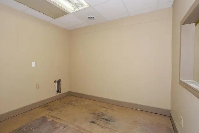 a kitchen with a sink and a mirror