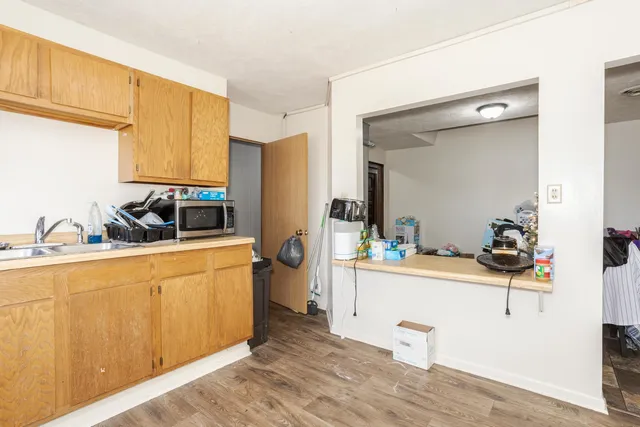 a living room with furniture and a mirror