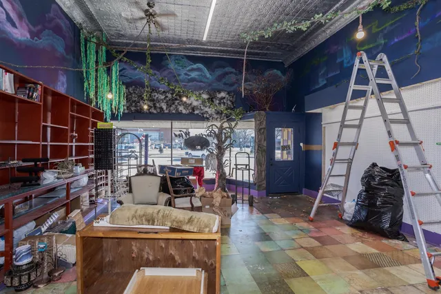 a room with lots of furniture and clutter