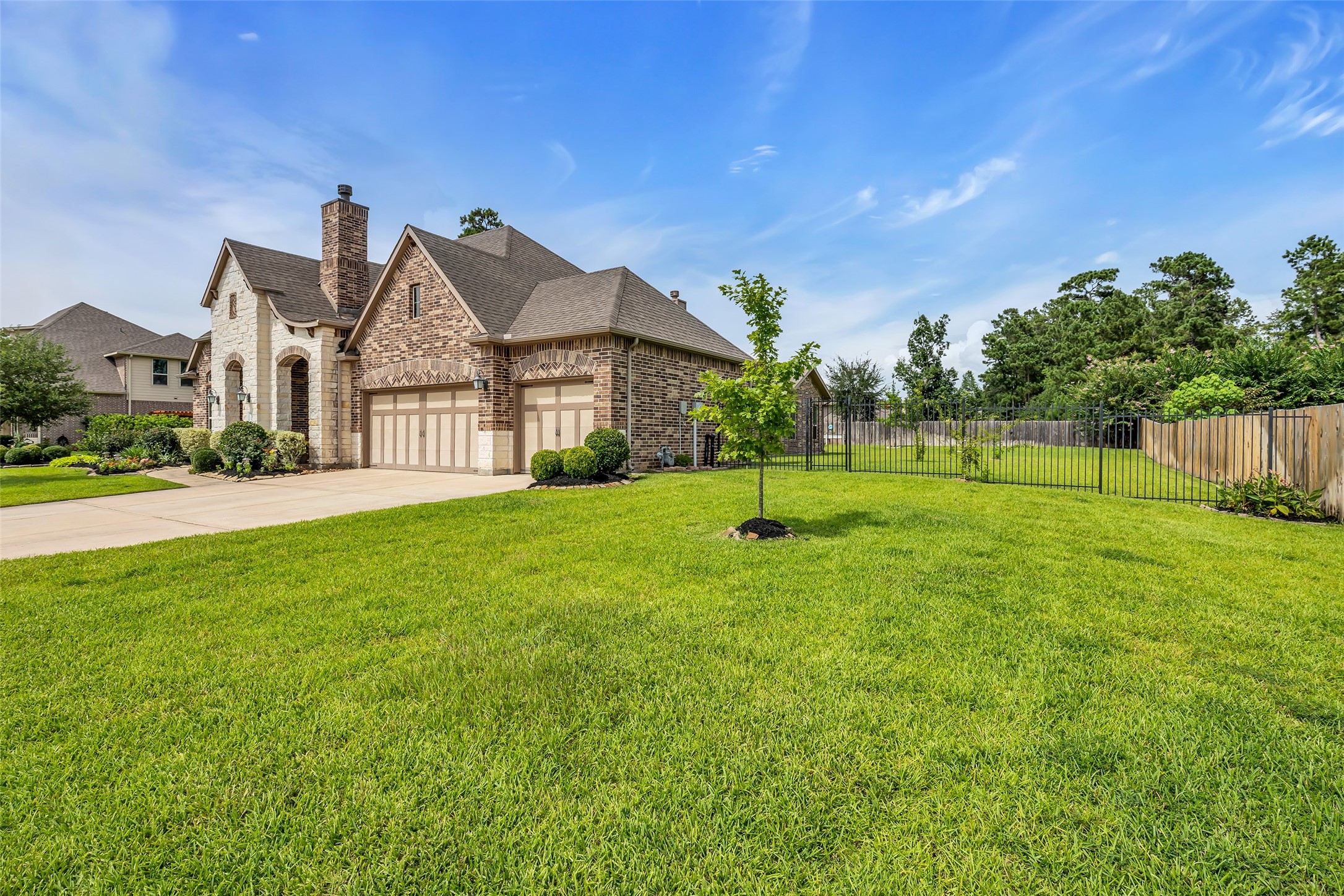 14003 South Evergreen Ridge Court Conroe, TX 77384 - Photo 39 of 43 Enjoy added privacy with expansive side yards and a greenbelt behind the home.