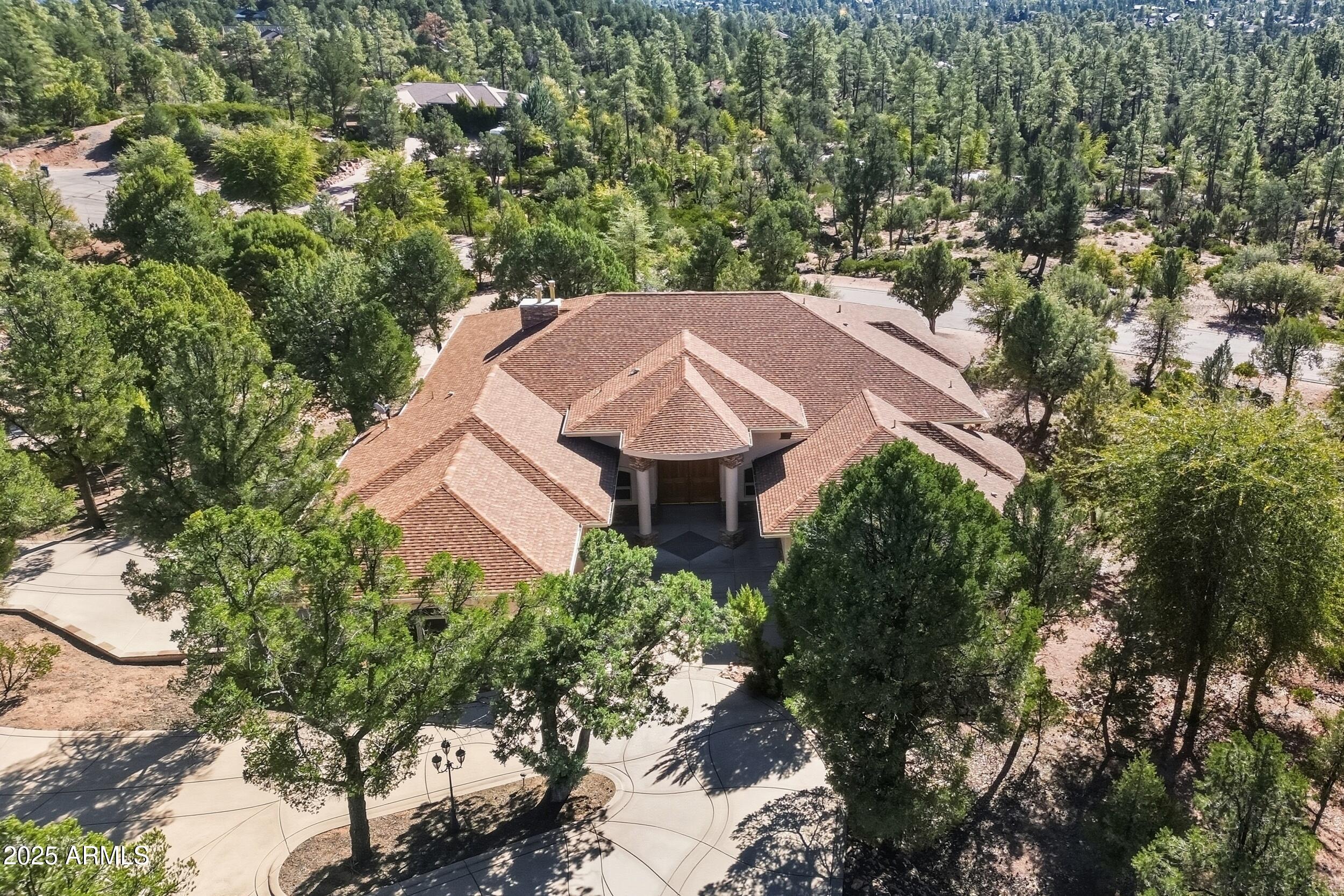 an aerial view of a house with a garden