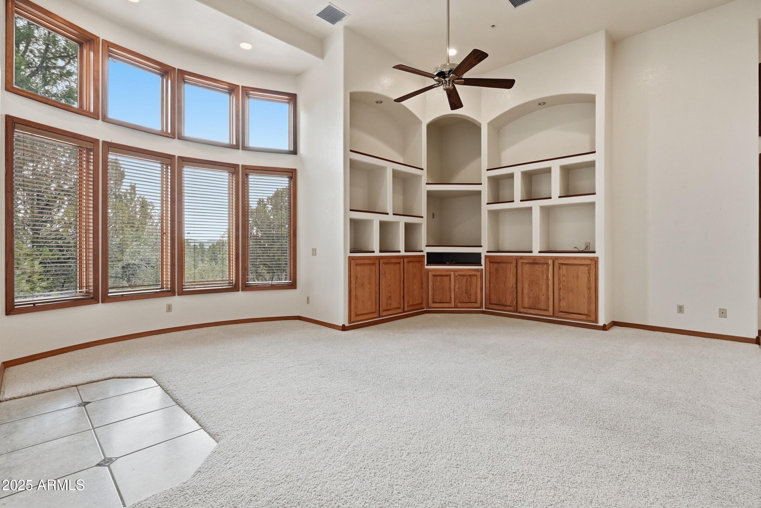 1606 Becky Circle Payson, AZ 85541 - Photo 15 of 58 an empty room with windows and ceiling fan