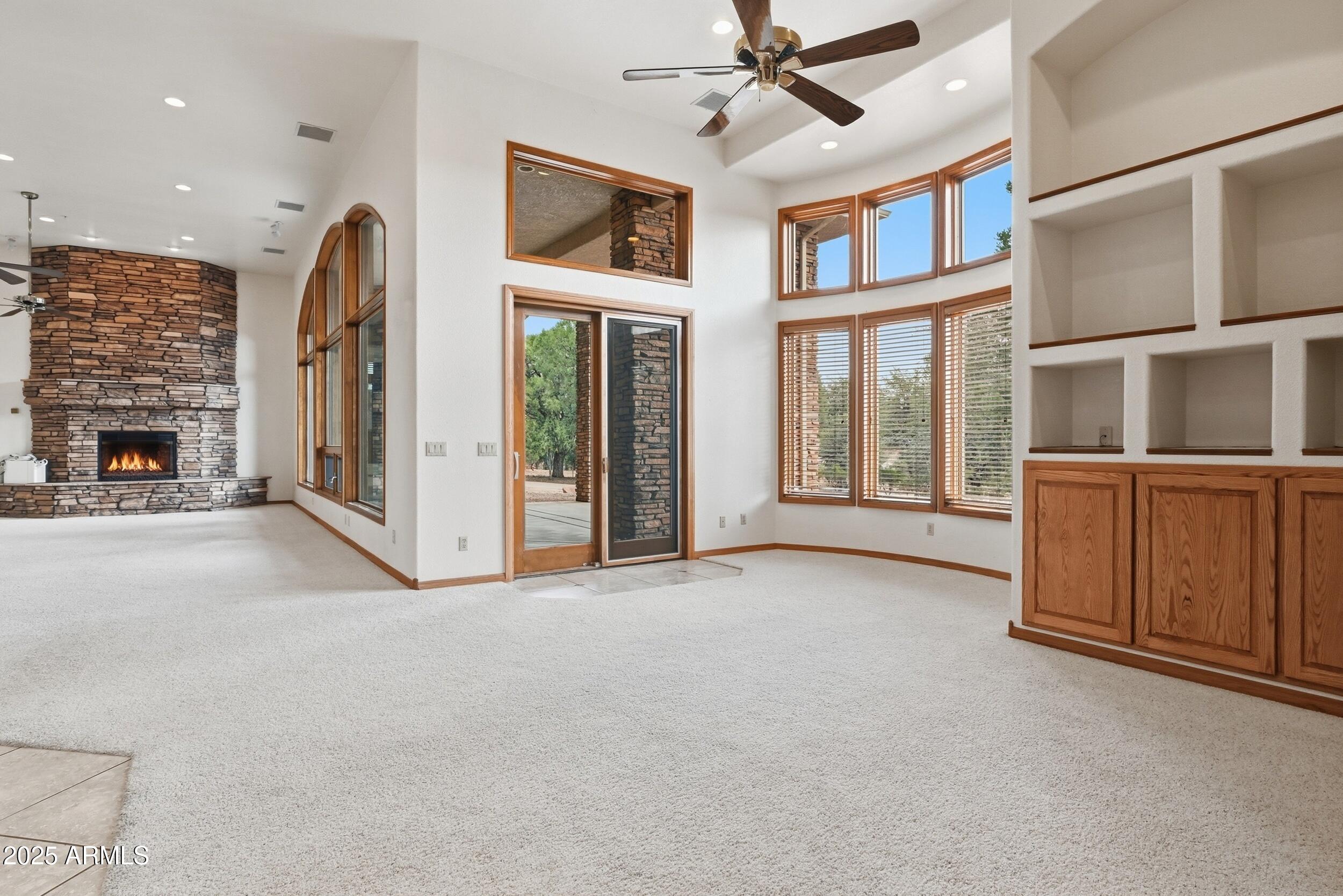 1606 Becky Circle Payson, AZ 85541 - Photo 17 of 58 a view of an empty room with fireplace and a chandelier