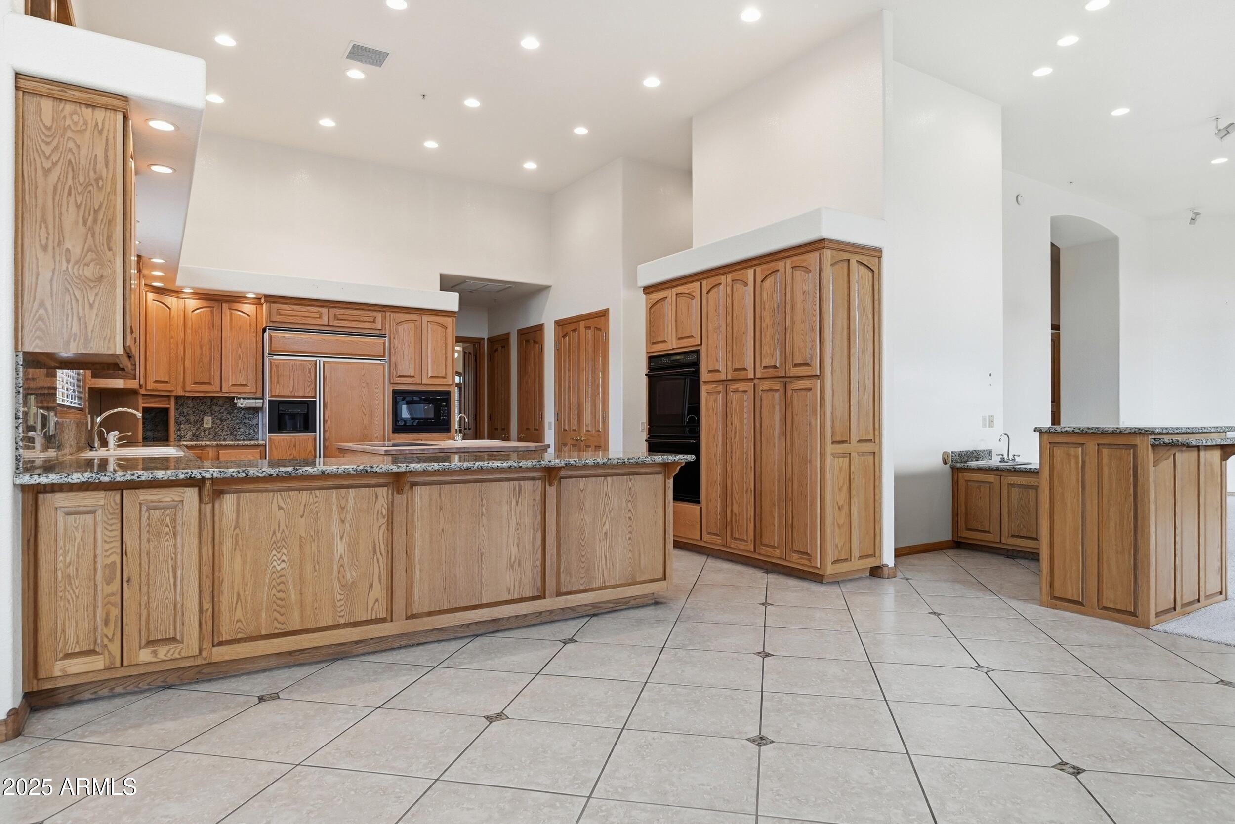 1606 Becky Circle Payson, AZ 85541 - Photo 18 of 58 a kitchen with stainless steel appliances a refrigerator and a sink