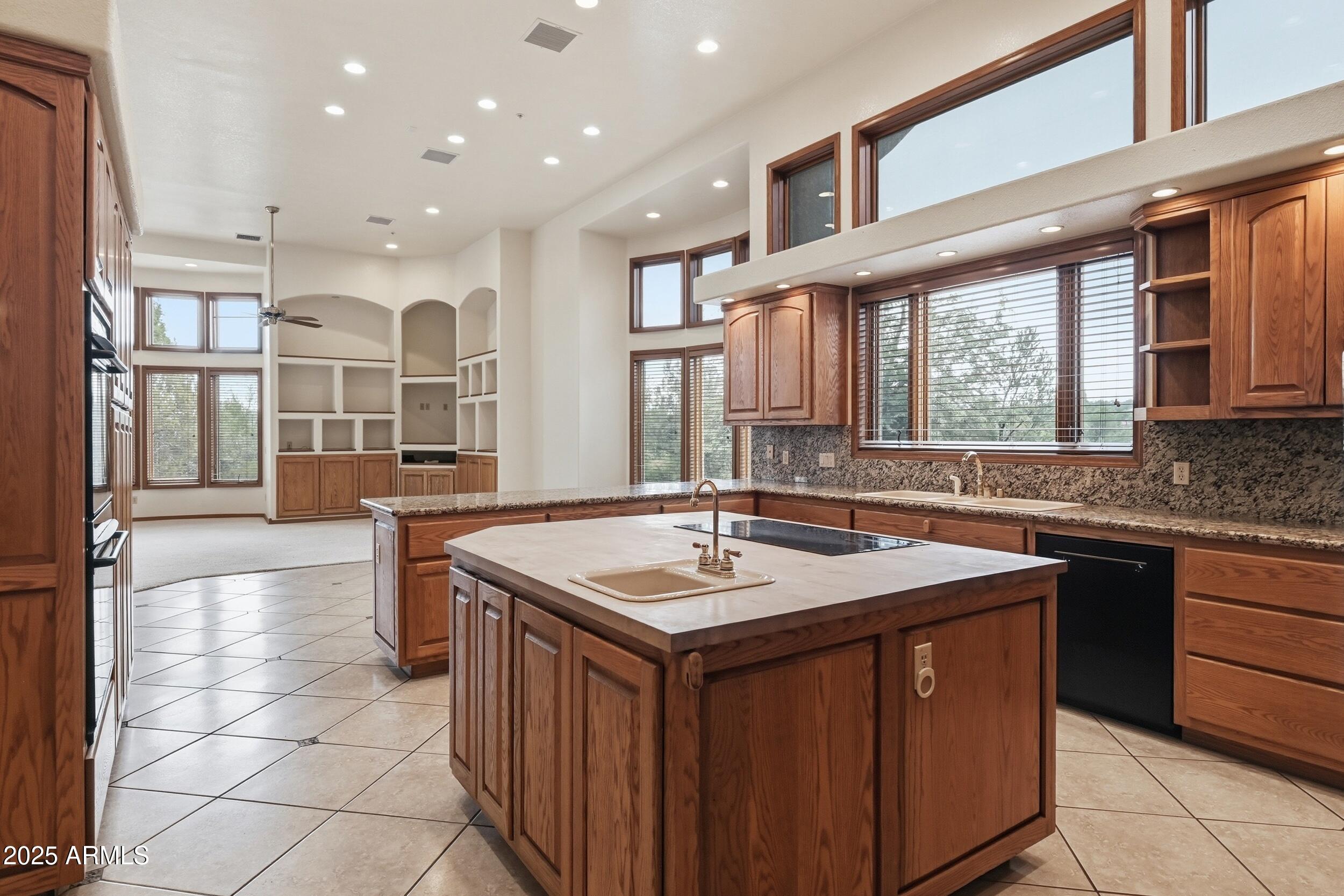 1606 Becky Circle Payson, AZ 85541 - Photo 24 of 58 a kitchen with a sink stove and cabinets