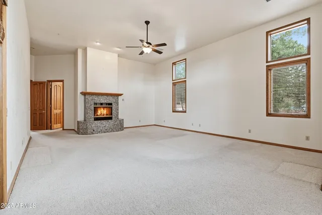 a white house that has a tree in front of it