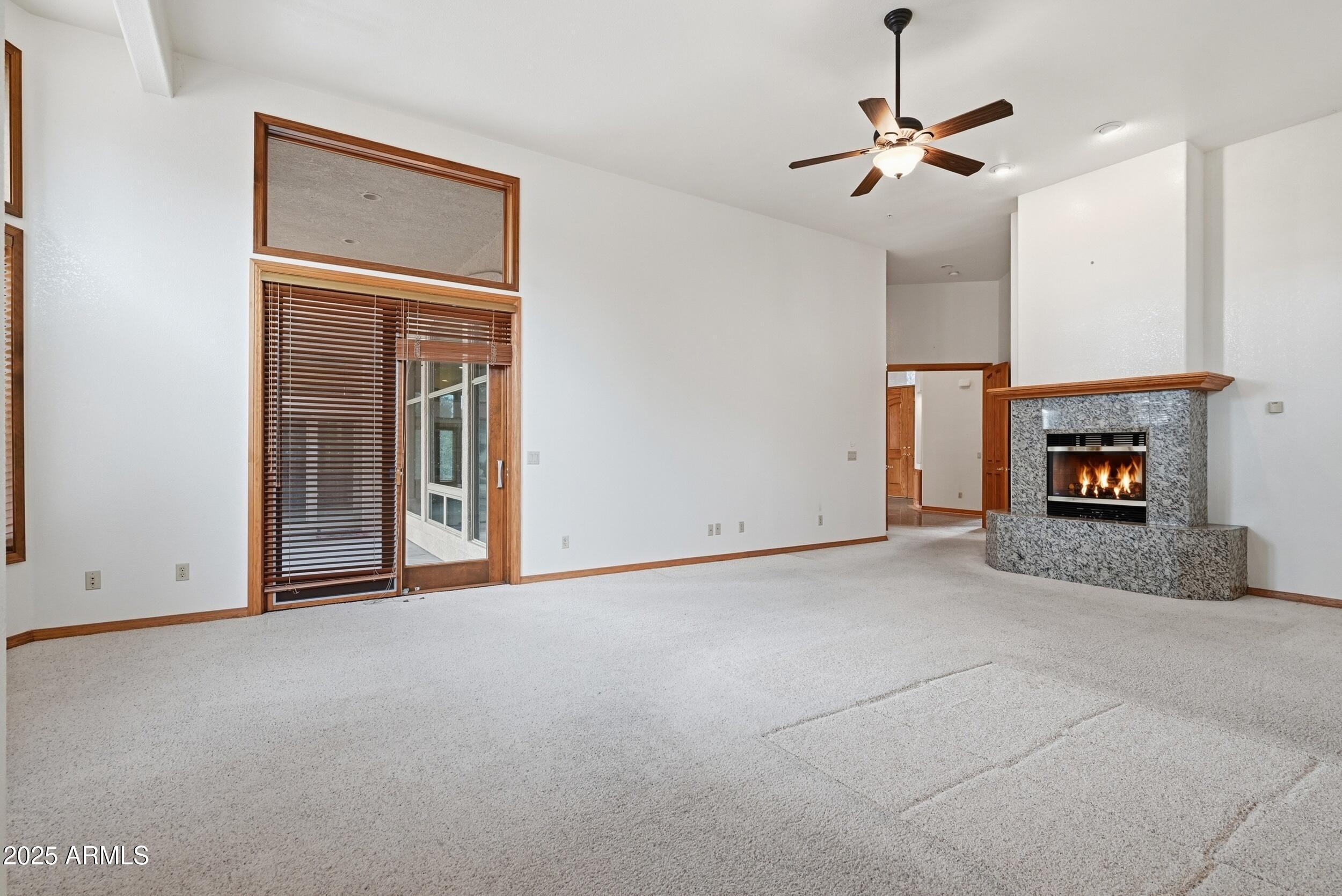 1606 Becky Circle Payson, AZ 85541 - Photo 34 of 58 a view of empty room with a fireplace