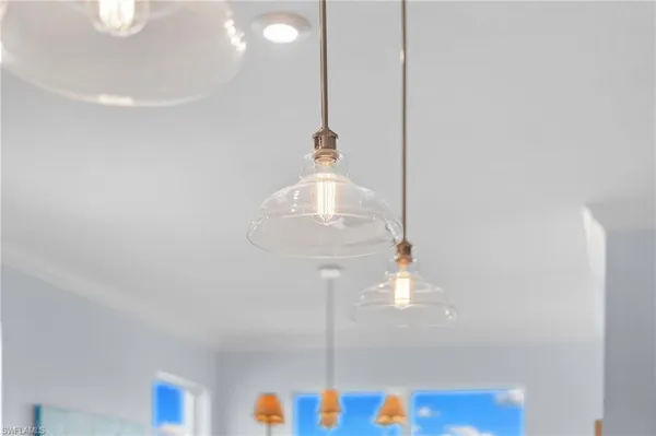 a kitchen with a window a sink and dining table view