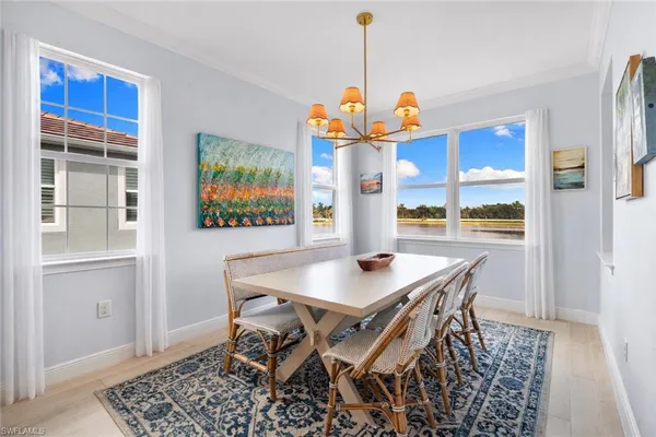 a view of kitchen with stainless steel appliances refrigerator stove microwave and cabinets