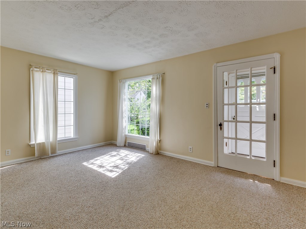 1149 Winston Road Cleveland, OH 44121 - Photo 6 of 28 Living room with hardwood under carpeting, great to have choices.