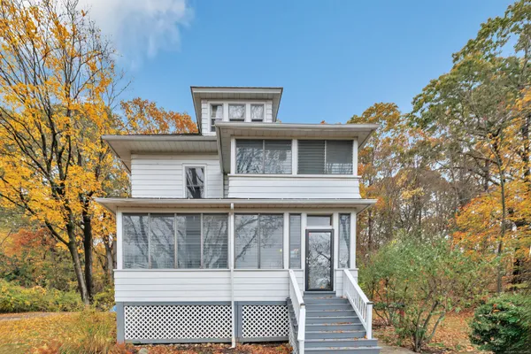 a front view of a house with a yard