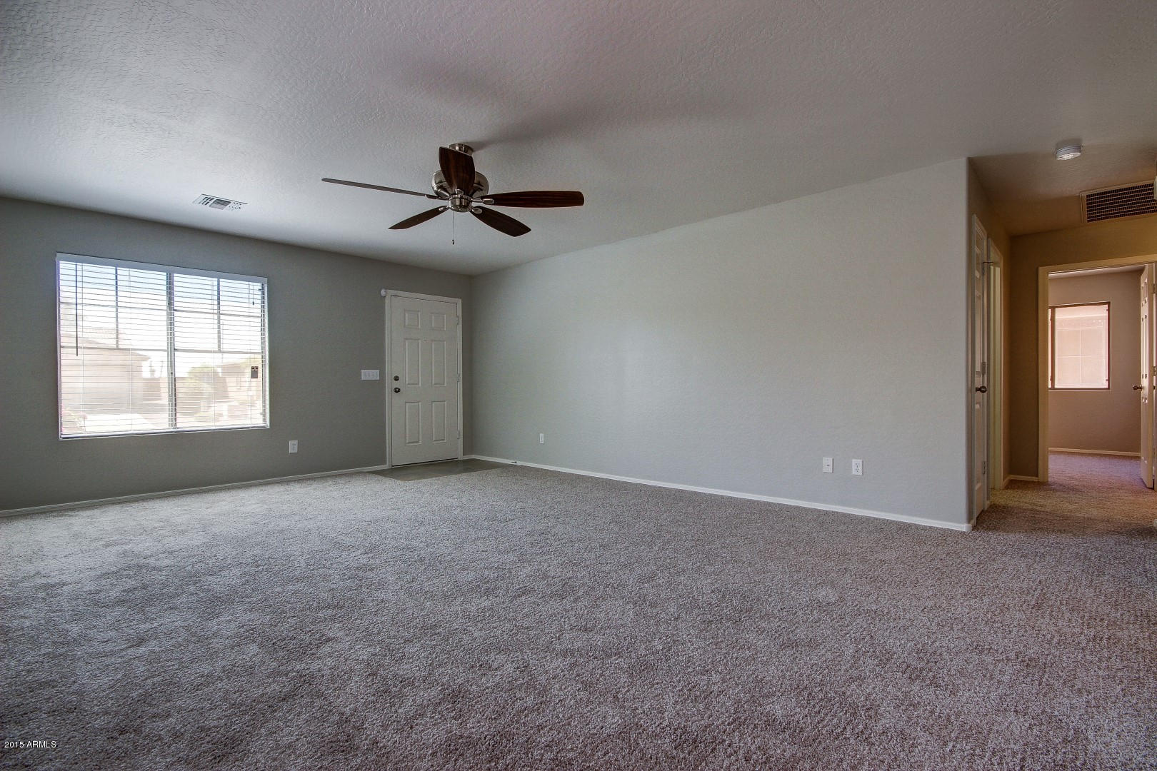 16148 West Boca Raton Road Surprise, AZ 85379 - Photo 11 of 24 a view of an empty room with a window