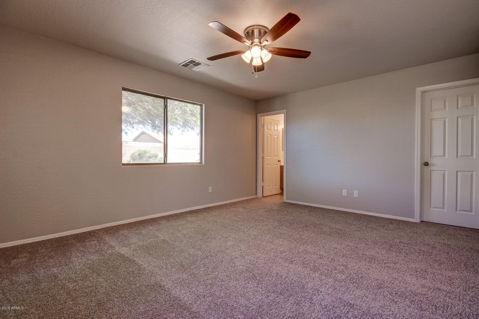 16148 West Boca Raton Road Surprise, AZ 85379 - Photo 12 of 24 an empty room with windows and fan