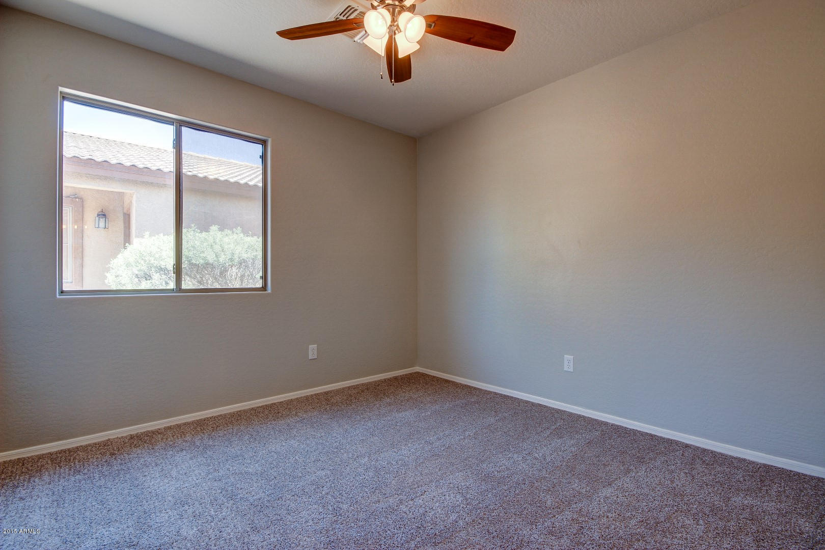 16148 West Boca Raton Road Surprise, AZ 85379 - Photo 16 of 24 an empty room with a window