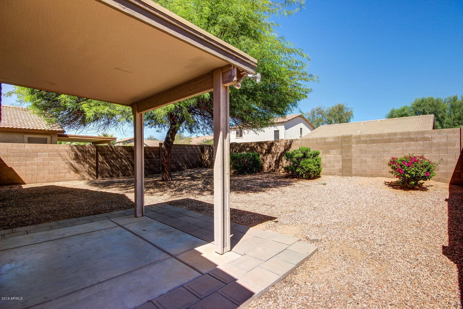 16148 West Boca Raton Road Surprise, AZ 85379 - Photo 19 of 24 a view of backyard with large tree