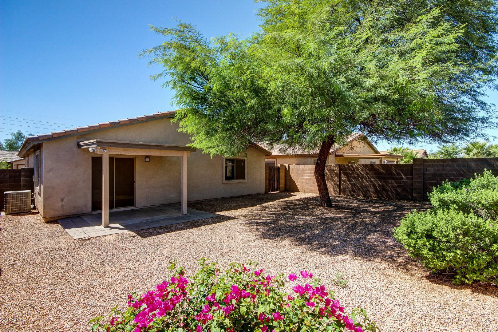 16148 West Boca Raton Road Surprise, AZ 85379 - Photo 20 of 24 a house with a tree in the background