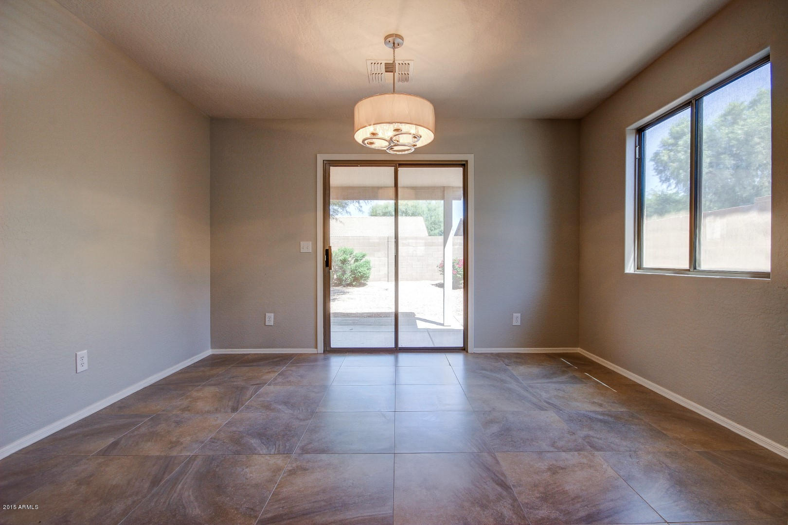 16148 West Boca Raton Road Surprise, AZ 85379 - Photo 7 of 24 a view of an empty room with a window