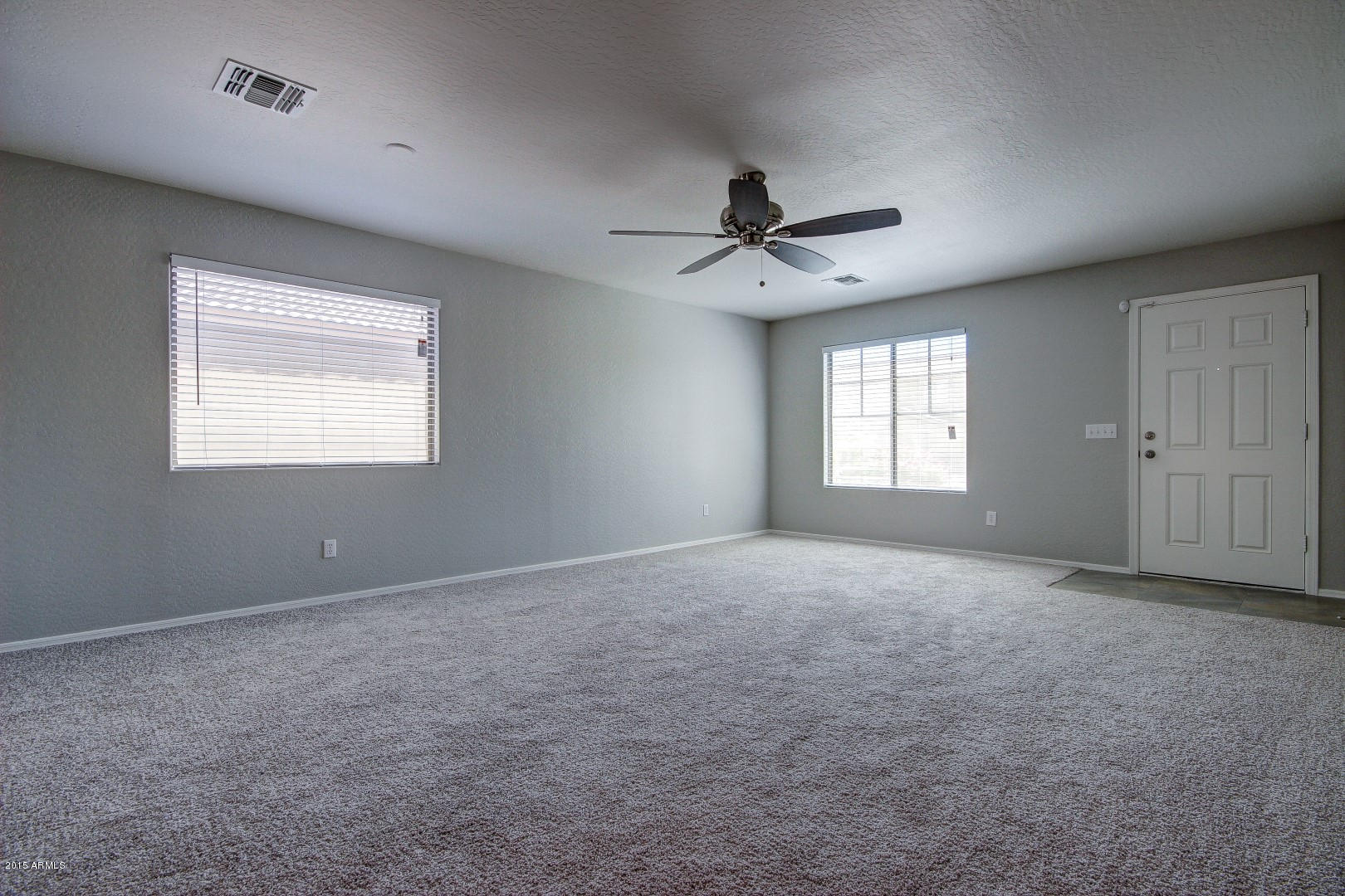 16148 West Boca Raton Road Surprise, AZ 85379 - Photo 8 of 24 a view of an empty room with a window