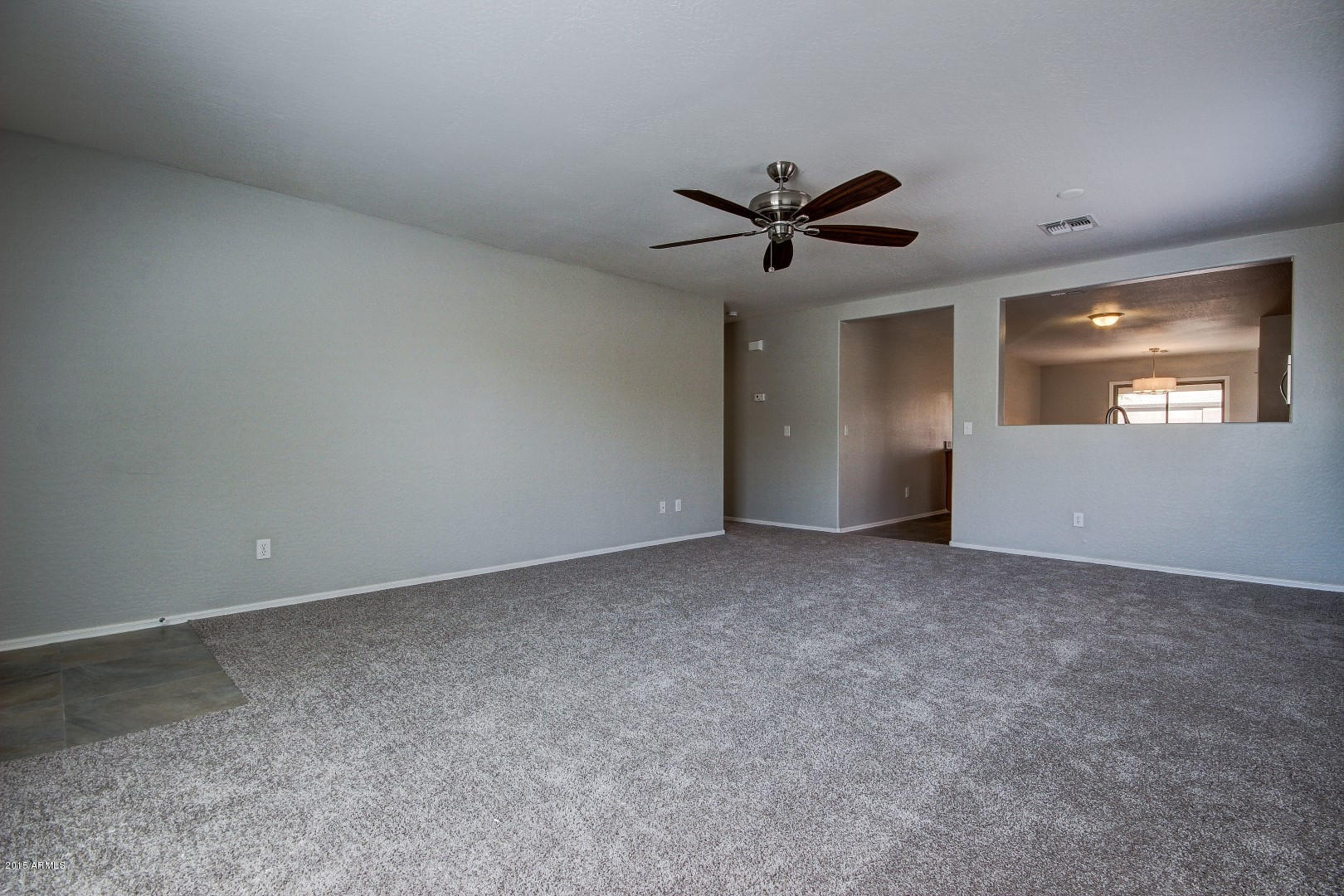 16148 West Boca Raton Road Surprise, AZ 85379 - Photo 10 of 24 a view of a big room with carpet