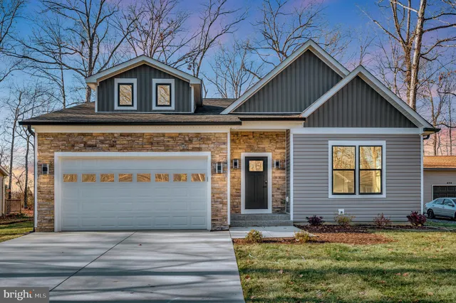 a front view of a house with yard